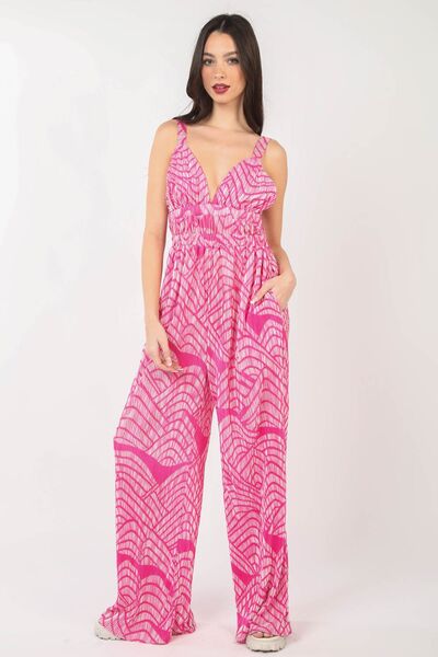 Women's printed pleated sleeveless wide leg jumpsuit in lightweight polyester with built-in side pockets