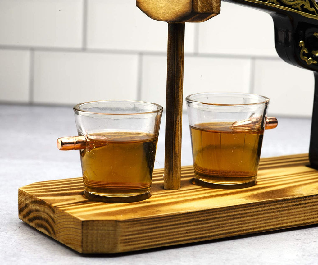 Black and gold hand-painted pistol whiskey decanter with two shot glasses on wooden display stand — view 4