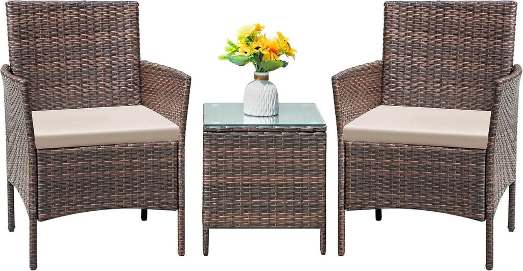 Three piece brown rattan outdoor patio set with two cushioned chairs and a tempered glass table — view 2
