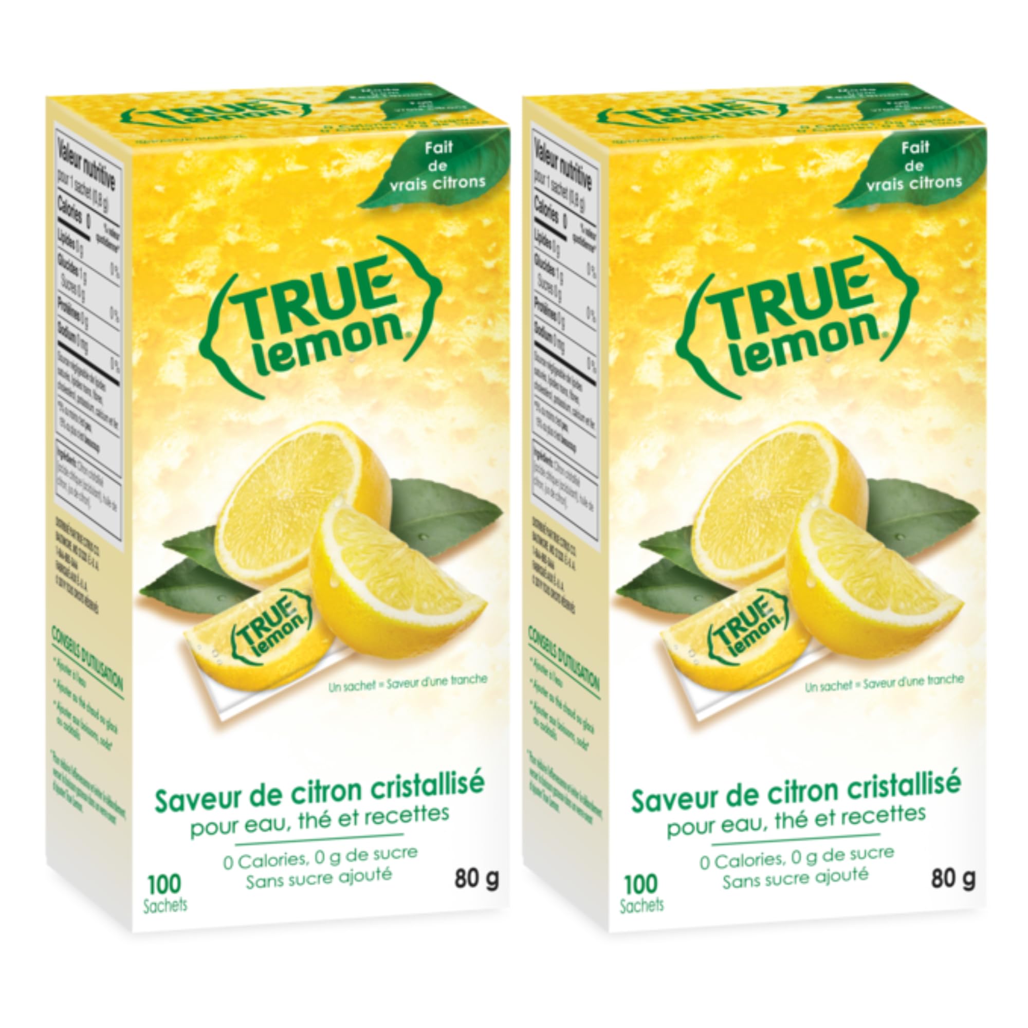 True Lemon water enhancer packets in dispenser boxes with fresh natural lemon wedges on display
