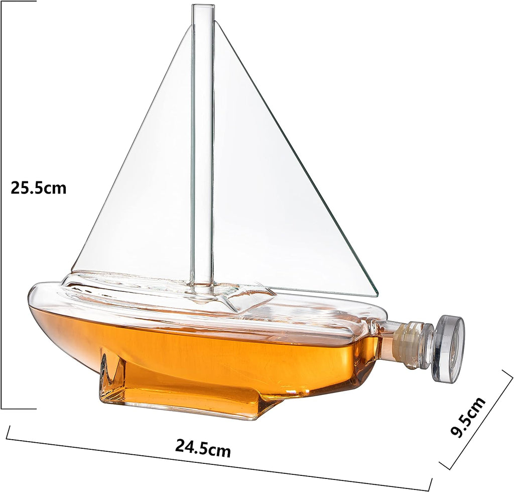 Glass sailboat whiskey decanter with built-in spigot resting on a sturdy wooden display base — view 4