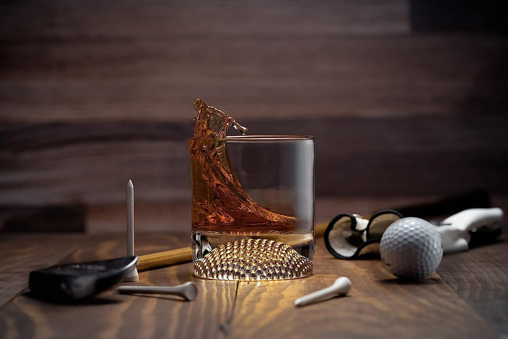 Set of four clear whiskey glasses with a textured golf ball base for home bars — view 3