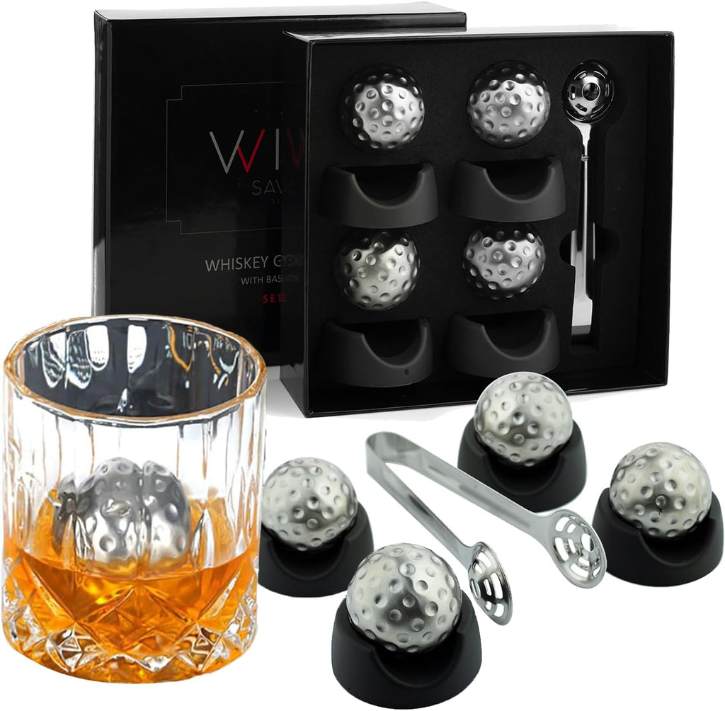 Stainless steel golf ball shaped whiskey stones chilling in a crystal glass of bourbon