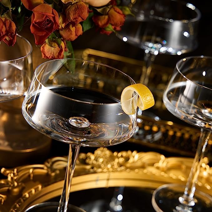 Four luxury glass martini coupes with an elegant silver mixing spoon for cocktail entertaining — view 4