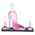 Clear borosilicate glass stiletto high heel whiskey decanter with two mini shoe shot glasses on base