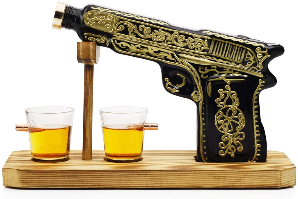 Black and gold hand-painted pistol whiskey decanter with two shot glasses on wooden display stand — view 5