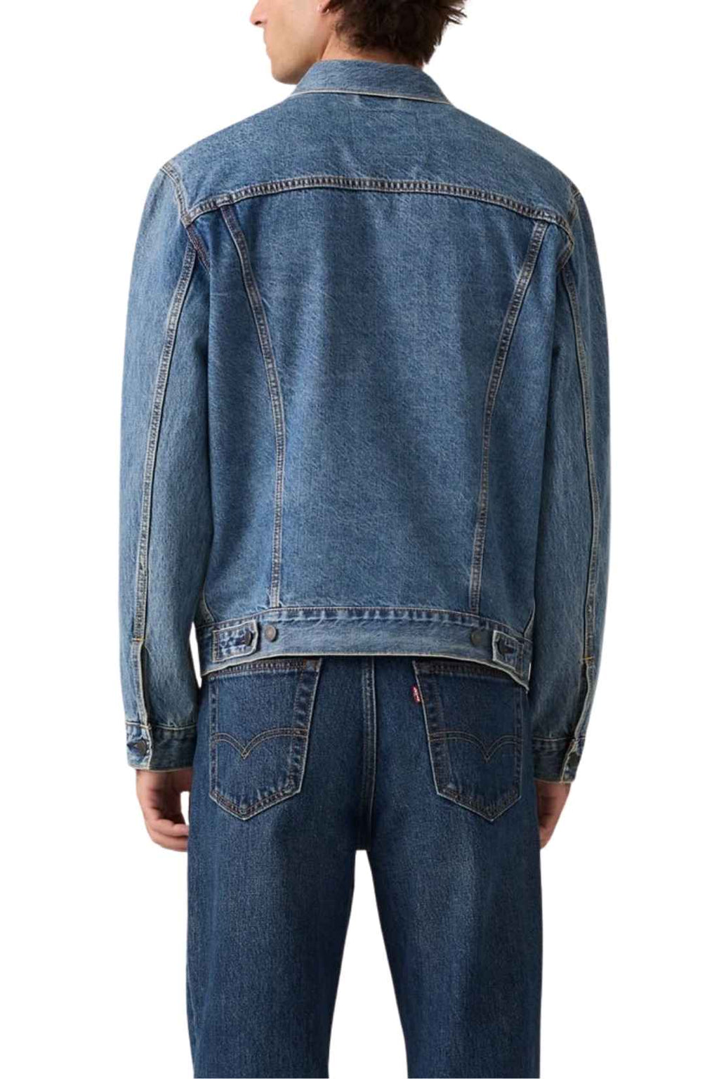 Men's classic medium wash denim trucker jacket featuring front logo buttons and chest flap pockets. — view 2