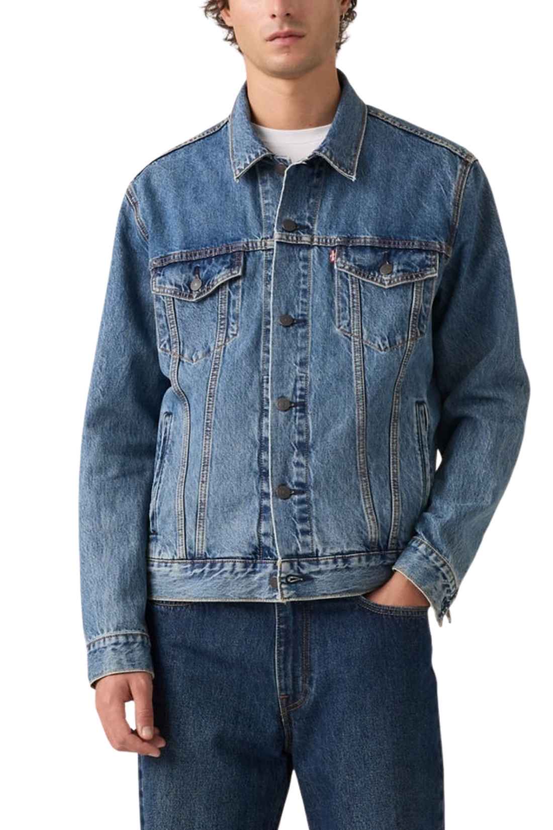 Men's classic medium wash denim trucker jacket featuring front logo buttons and chest flap pockets.