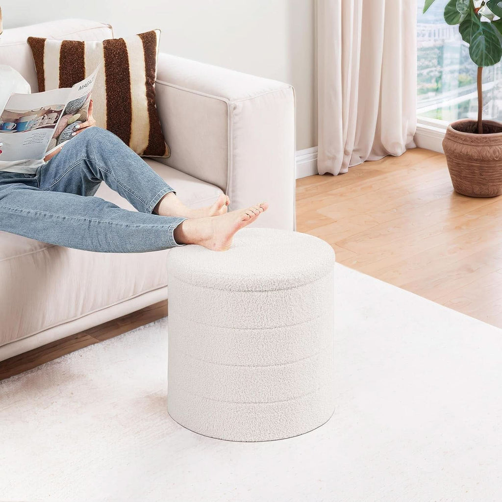 Round white velvet storage ottoman with flippable wooden tray top used as a coffee table — view 2