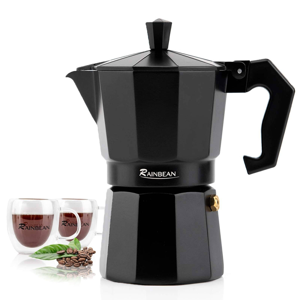 Classic Italian moka pot stovetop espresso maker with two matching coffee cups on kitchen counter