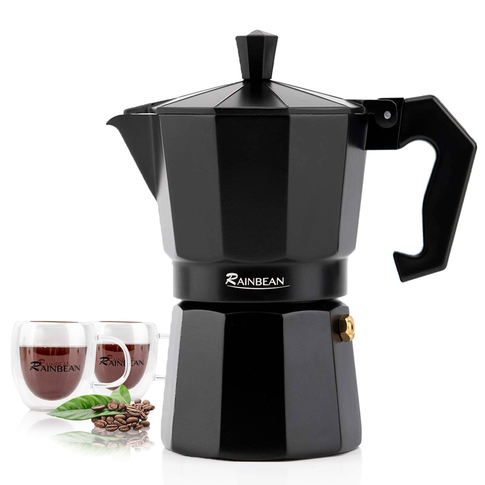 Classic Italian moka pot stovetop espresso maker with two matching coffee cups on kitchen counter