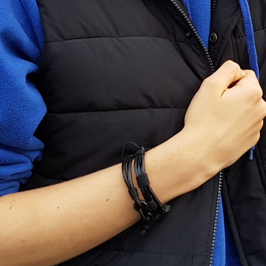 Men's black multi-strand leather and woven cord bracelet displayed in a sophisticated dark gift box — view 4