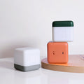 Portable charging LED desk lamp with lightweight plastic shade, USB cable, and simple push button