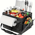 Black fabric collapsible BBQ grill caddy with built-in paper towel holder and large storage pockets