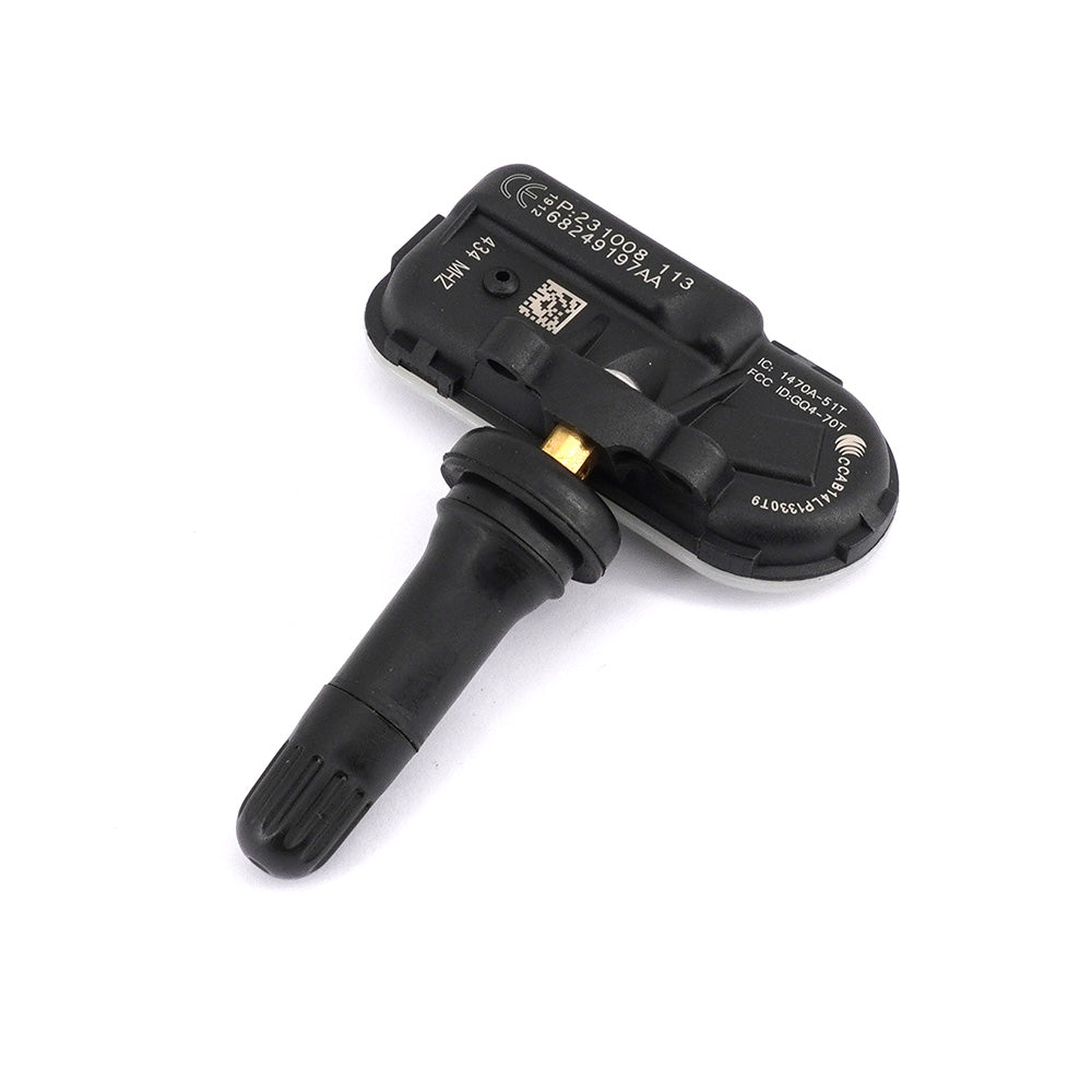 Four black automotive tyre pressure monitoring sensors arranged on a clean white background — view 3