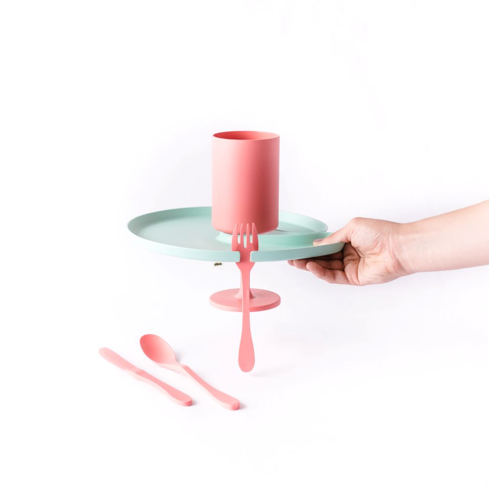 Eco-friendly five-piece plant-based party tableware set including plate, cup, fork, knife, and spoon.