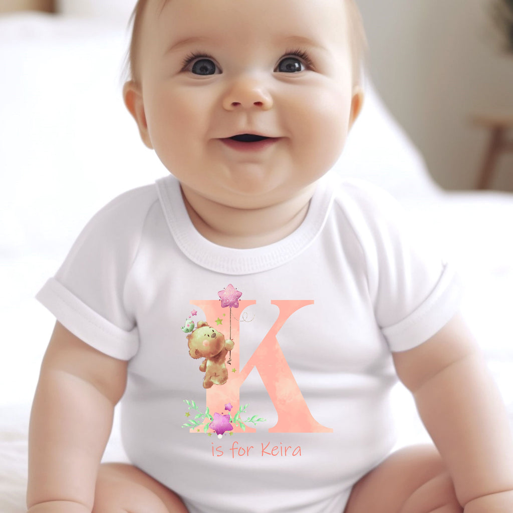Personalised pink baby outfit featuring teddy bear motifs custom printed initial cotton bib and newborn vest — view 2