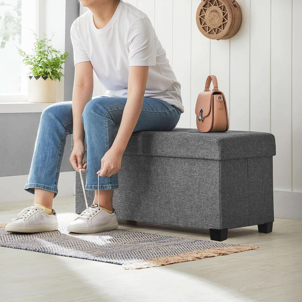 Slate gray storage ottoman bench in linen-look fabric with open lid showing hidden storage — view 5