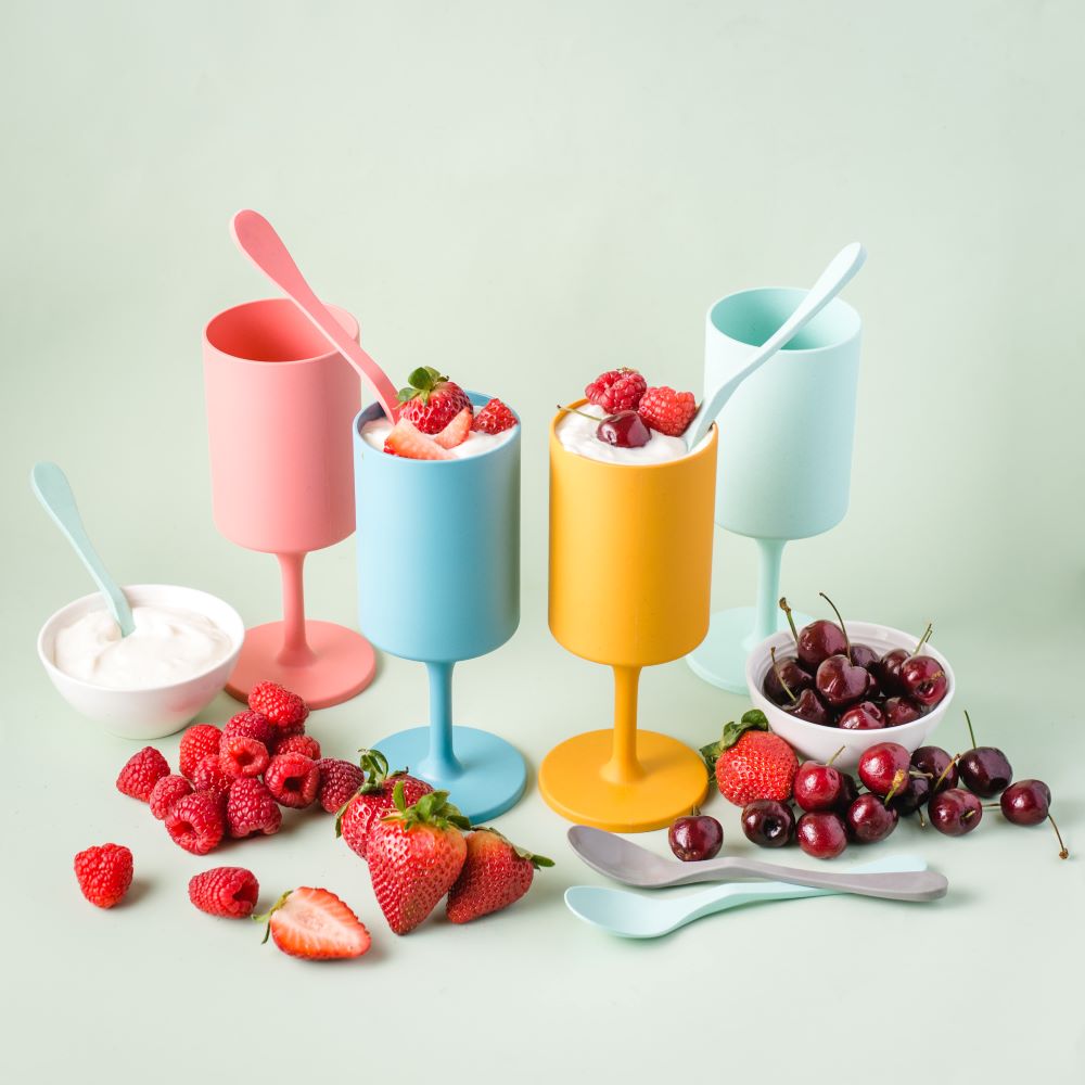 Four colorful reusable outdoor wine glasses in orange, coral, aqua, and teal made from bamboo — view 5
