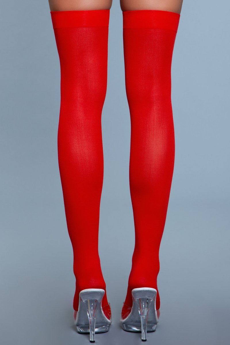 Opaque nylon thigh highs with solid band, showcasing seamless toe-to-thigh coverage for women's fashion