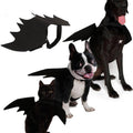 Black felt bat wings dog costume featuring adjustable Velcro straps on a white background