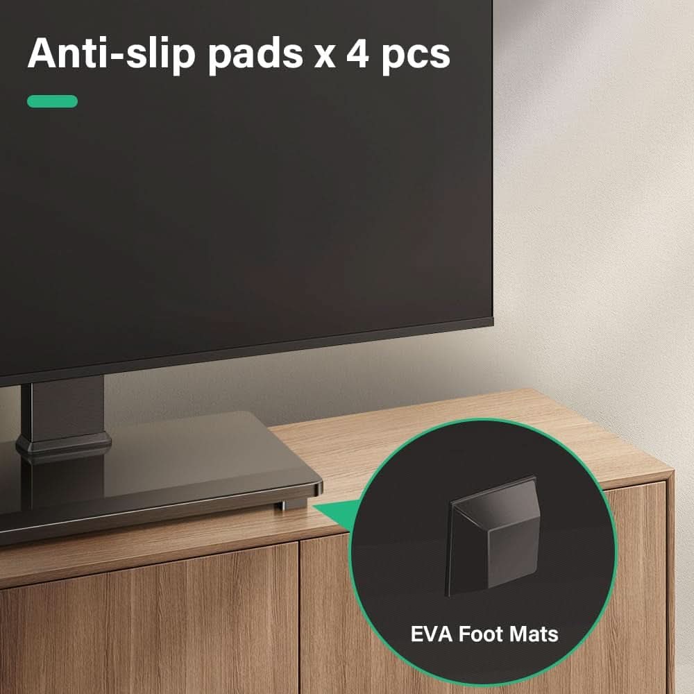 Universal TV stand with a tempered glass base supporting a large flat screen television display — view 4