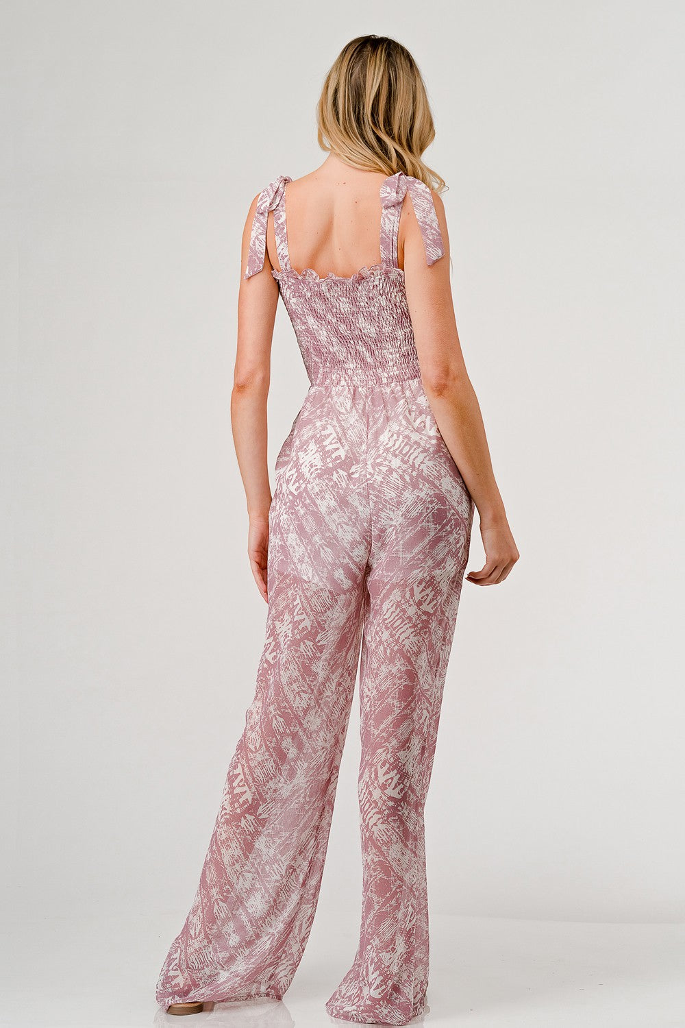 Printed tie shoulder wide leg jumpsuit in lightweight rayon with pockets and smocked details — view 2