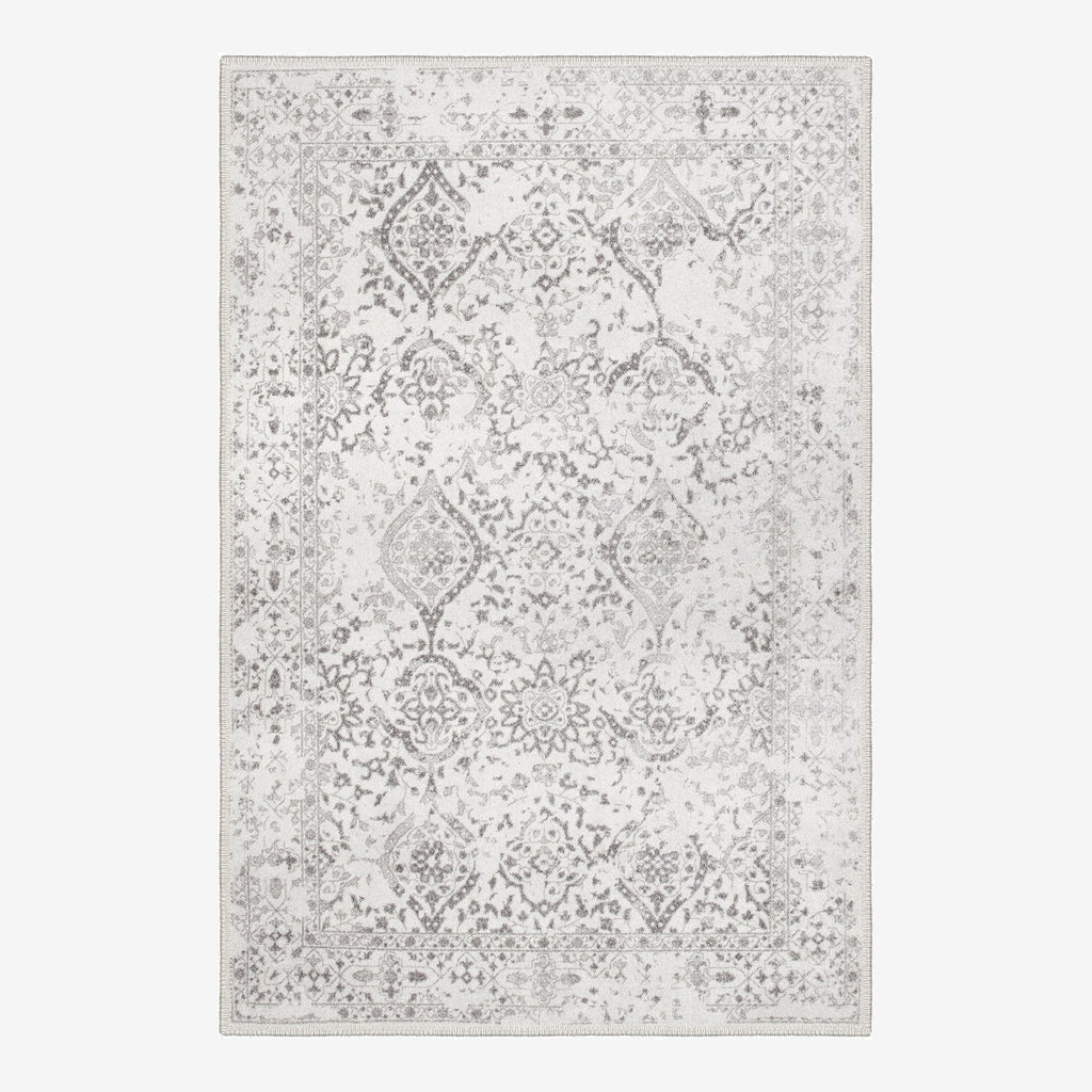 Dachstein vintage boho area rug featuring a low pile cotton surface and non slip base