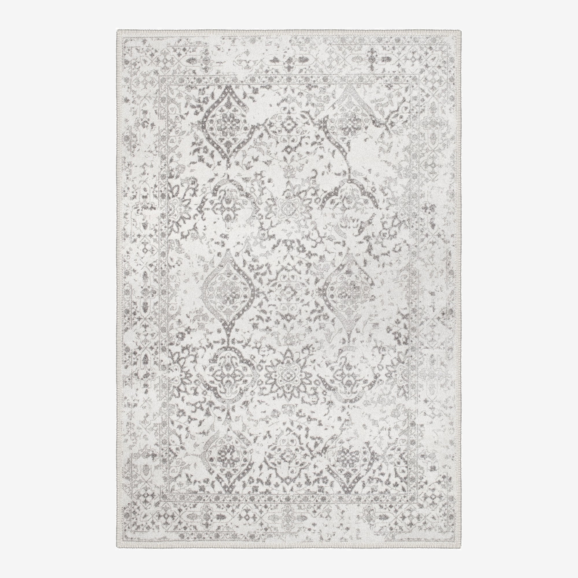 Dachstein vintage boho area rug featuring a low pile cotton surface and non slip base