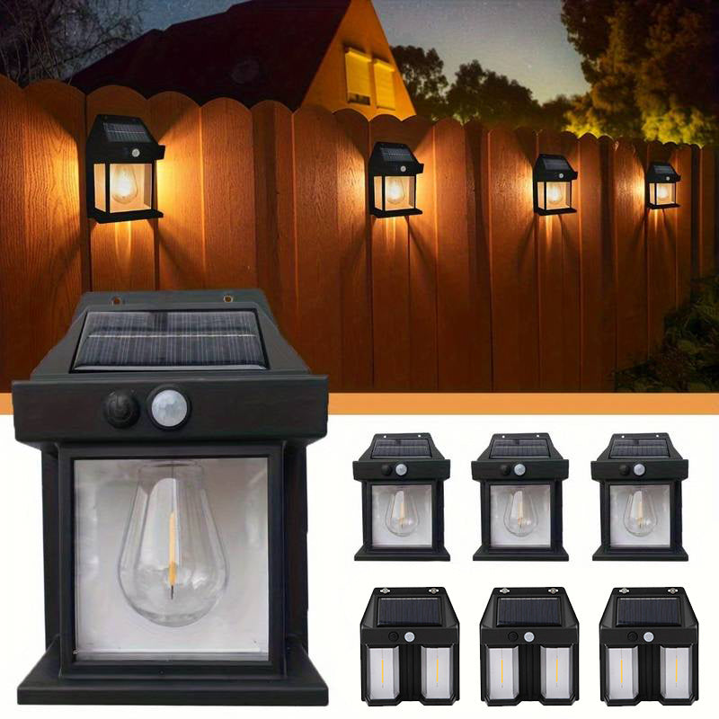 Two black plastic solar motion sensor LED outdoor security lights mounted on a wall — view 4