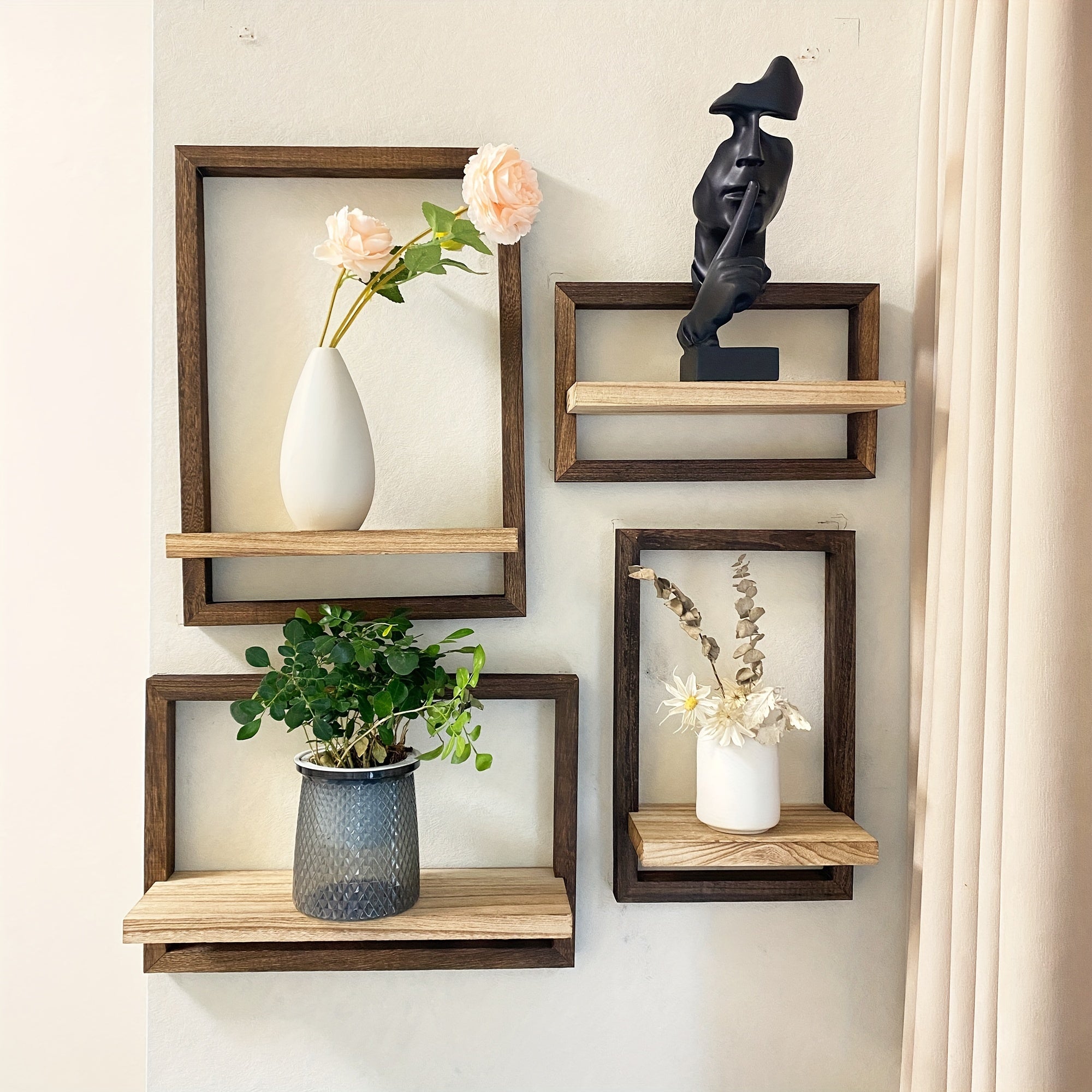 Four piece brown wooden floating wall shelf set displaying small decor items and plant pots — view 2