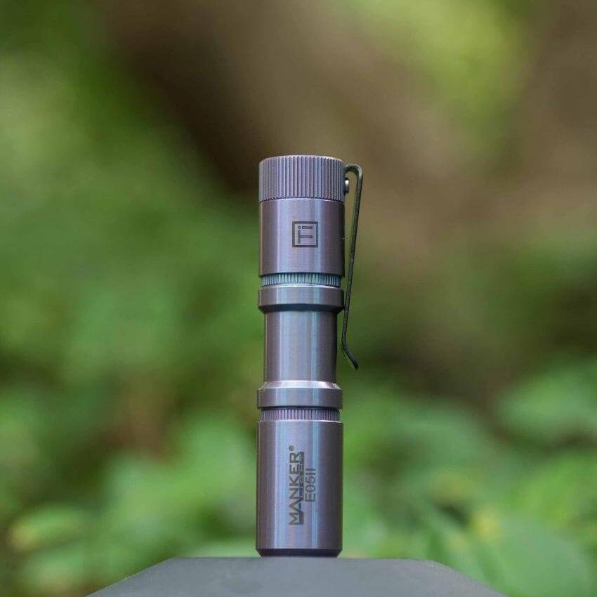 Manker E05II Ti EDC Flashlight in bead-blasted titanium with deep carry pocket clip — view 5