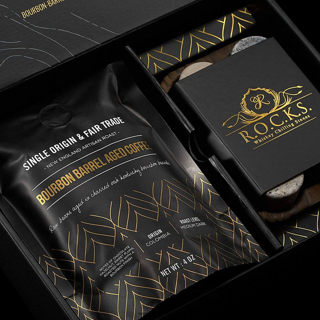 Bourbon barrel aged coffee bag next to six handcrafted granite whiskey chilling stones — view 3