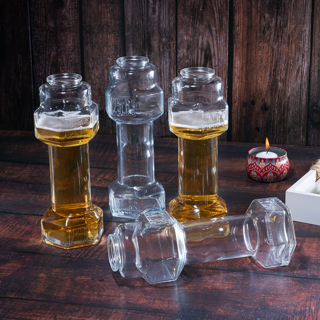 Set of four clear hollow glass dumbbell shaped novelty whiskey and beer drinking glasses — view 3