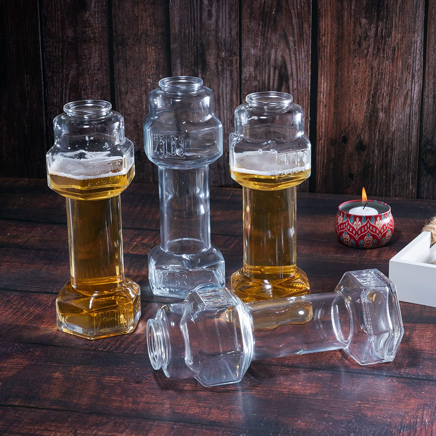 Set of four clear hollow glass dumbbell shaped novelty whiskey and beer drinking glasses — view 3