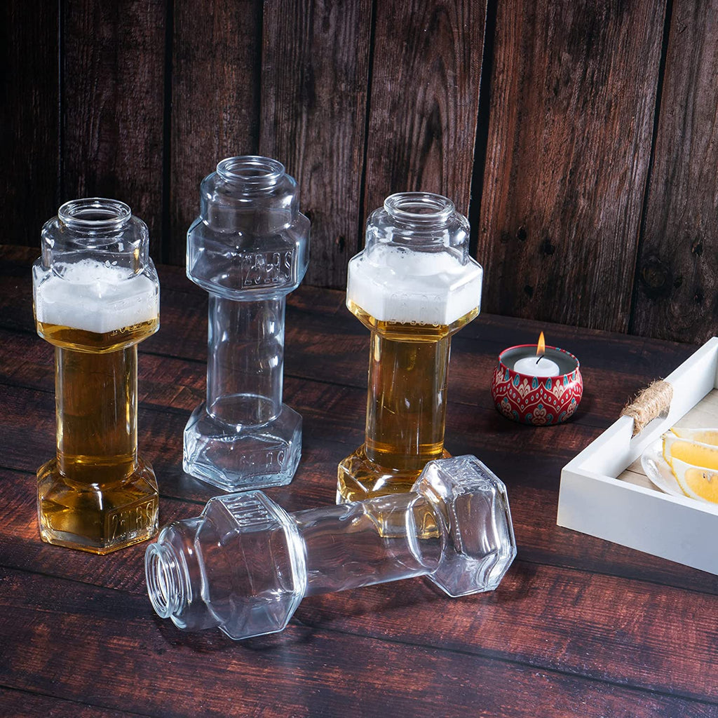 Set of four clear hollow glass dumbbell shaped novelty whiskey and beer drinking glasses — view 4