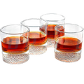 Set of four clear whiskey glasses with a textured golf ball base for home bars
