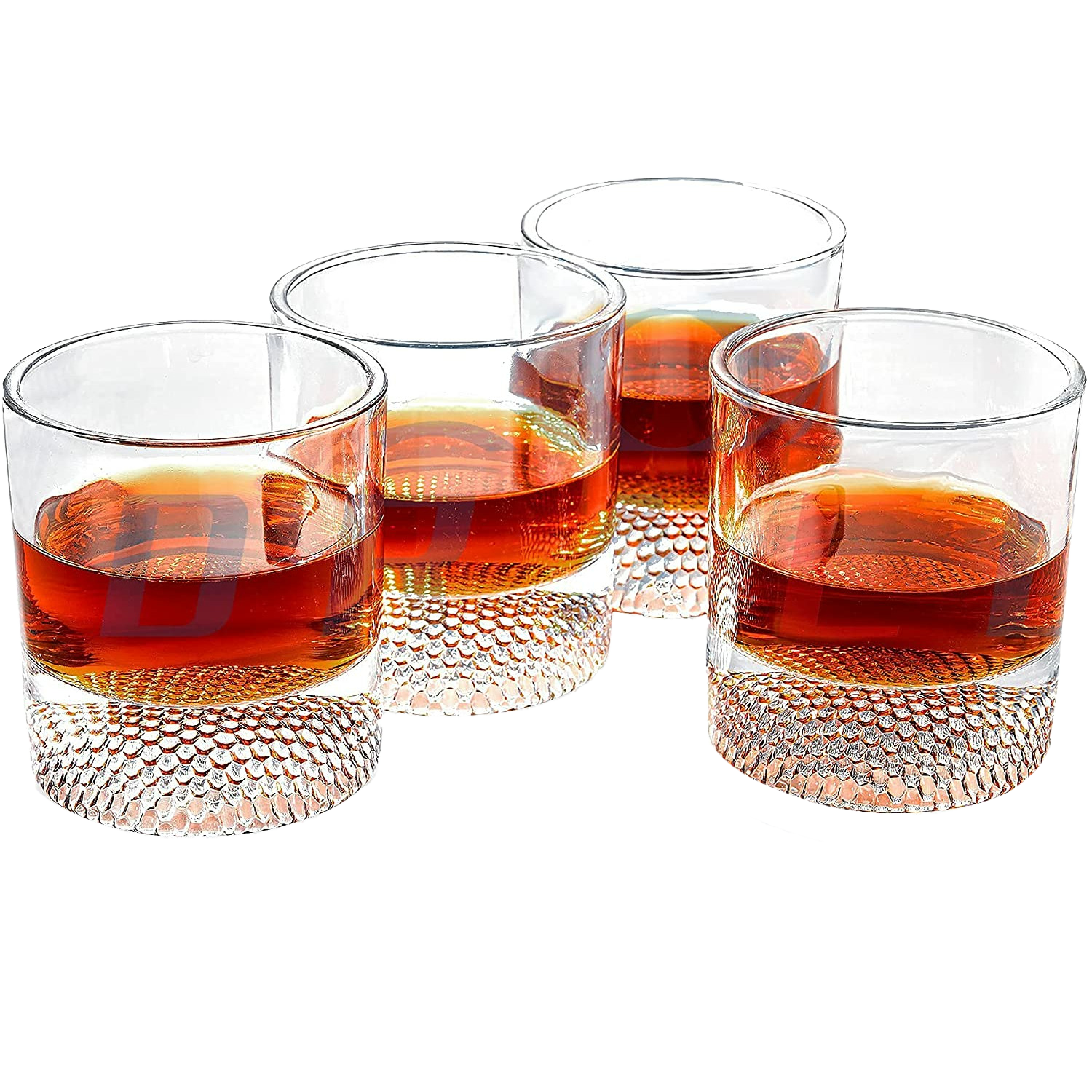 Set of four clear whiskey glasses with a textured golf ball base for home bars
