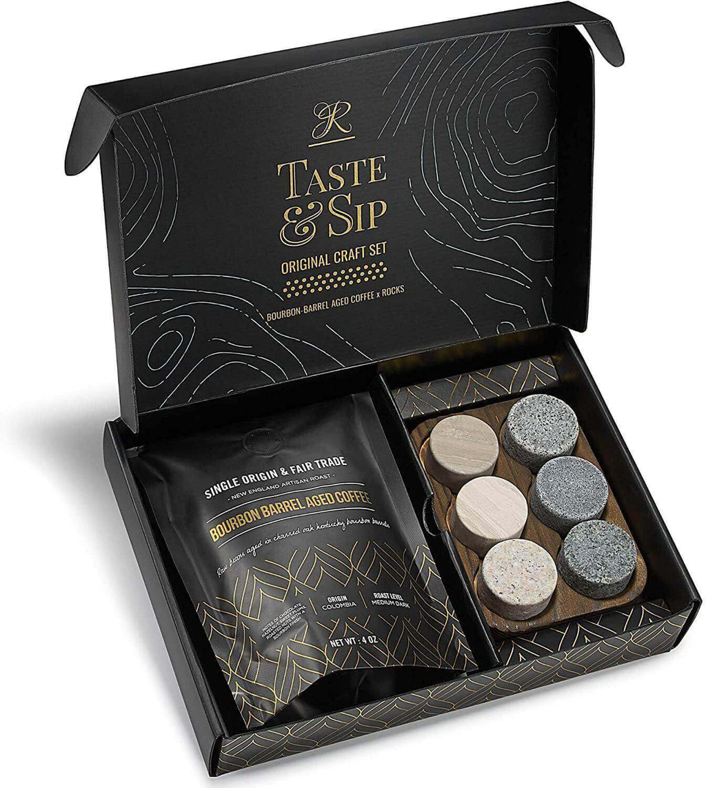 Bourbon barrel aged coffee bag next to six handcrafted granite whiskey chilling stones