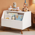 White solid wood toy chest with front-facing book display and slow-closing safety lid.
