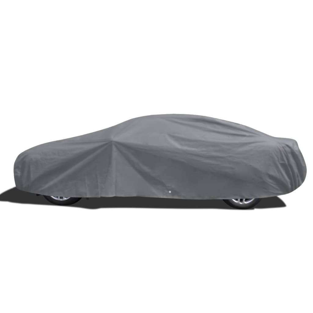 Medium grey nonwoven car cover securely fitted over a sedan for outdoor weather protection — view 2