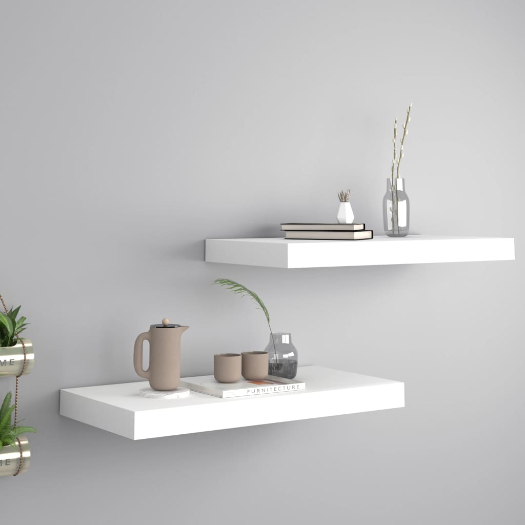 Two white modern minimalist floating wall shelves mounted seamlessly in a contemporary home setting