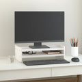 White solid pine wood monitor stand on a modern desk with underneath storage space