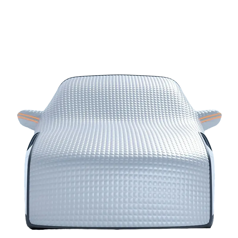 Universal car snow shield in silvery finish covering a vehicle windshield for winter ice protection