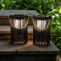 Two black metal 10.5 inch outdoor solar lanterns with rustic jute rope handles for garden lighting