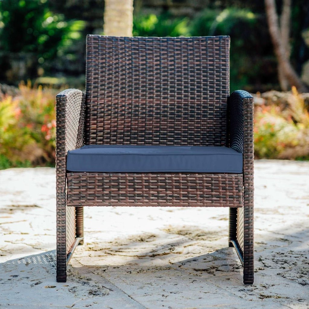 Brown 3-piece wicker outdoor patio bistro set with navy cushions and a square side table. — view 3