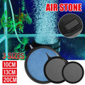 Gray and black aquarium air bubble disk stone producing fine micro-bubbles underwater.