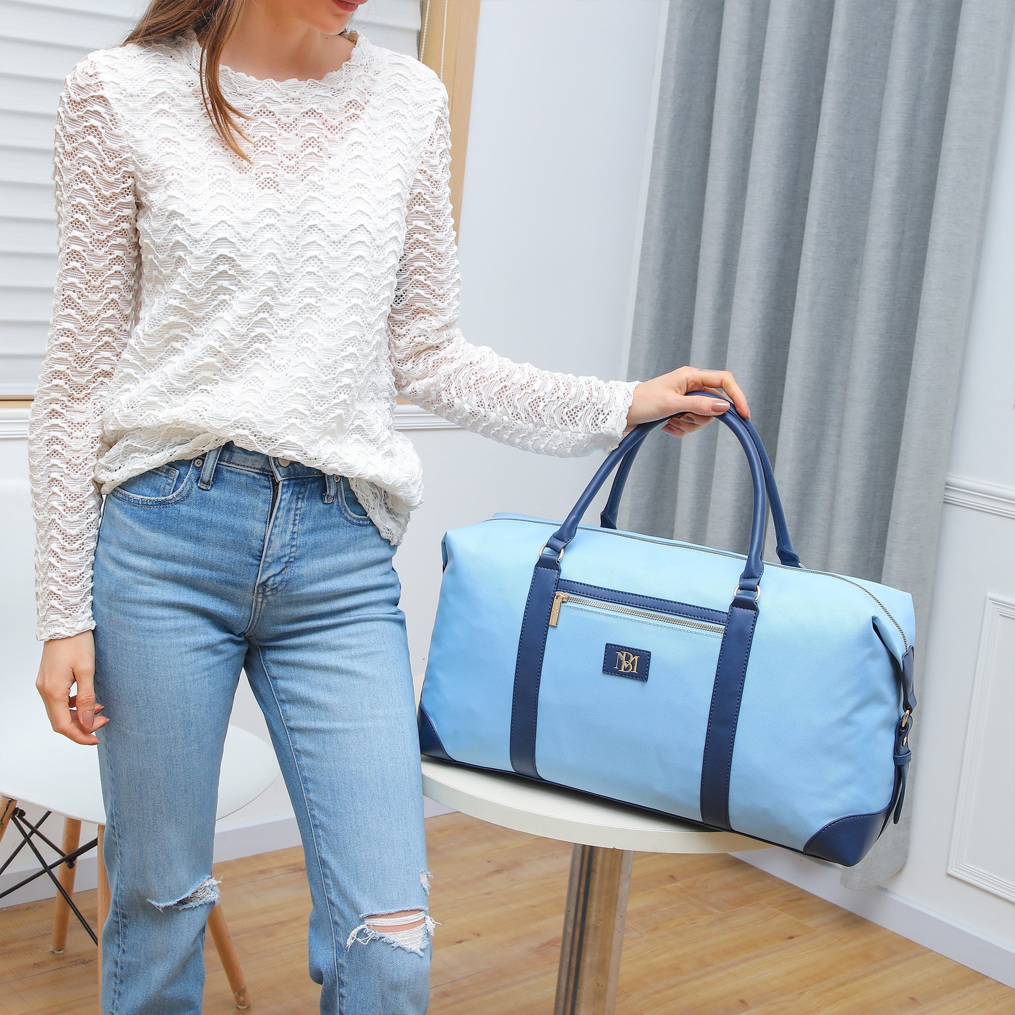 Canvas weekender duffel bag with vegan leather straps and shiny gold hardware — view 4