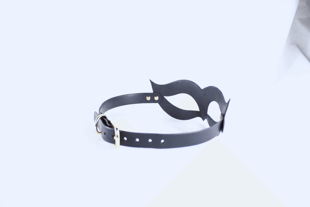 Handmade black leather fetish mask with gold-tone rivets and adjustable buckle strap for a secure fit. — view 3