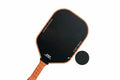 NNETM T700 carbon fiber pickleball paddle with black textured face and ergonomic anti-slip grip